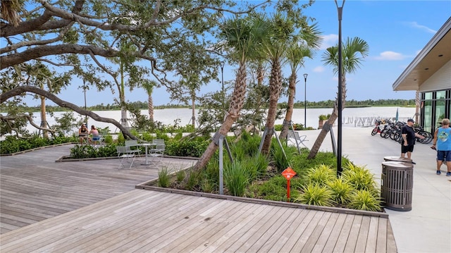 wooden deck featuring a water view