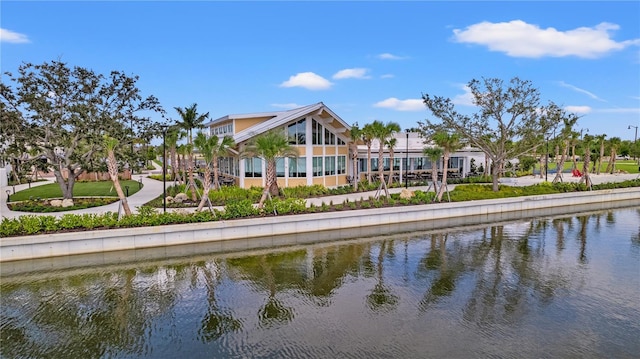 rear view of house featuring a water view