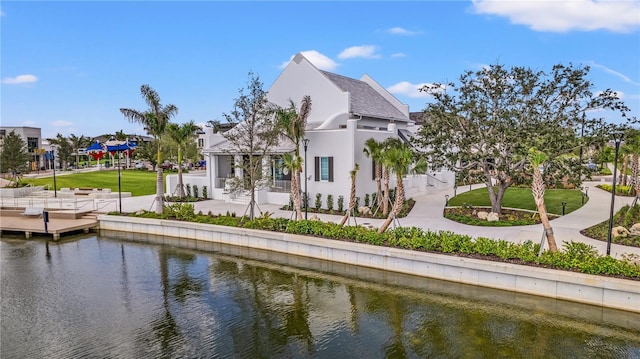 rear view of property featuring a water view