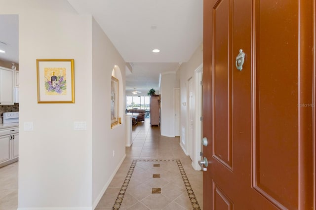 hallway featuring light tile patterned floors