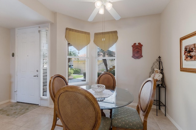 dining room featuring light tile patterned floors and ceiling fan