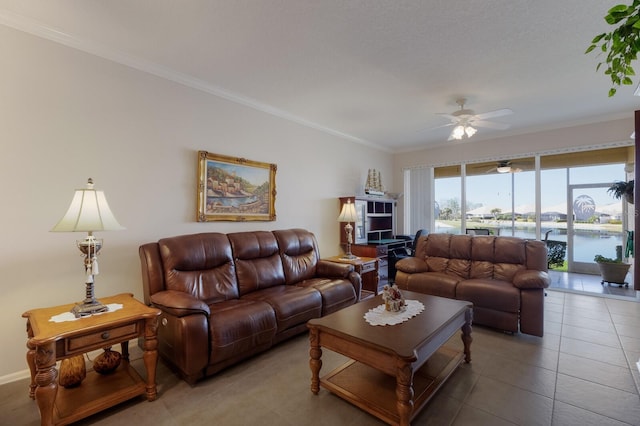 living room with tile patterned flooring, crown molding, a water view, and ceiling fan