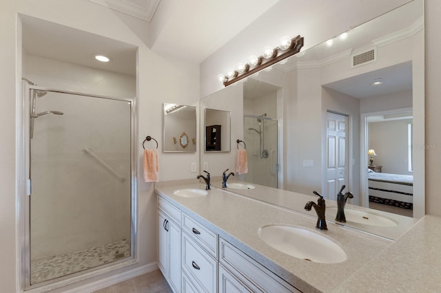 bathroom featuring walk in shower, ornamental molding, and vanity