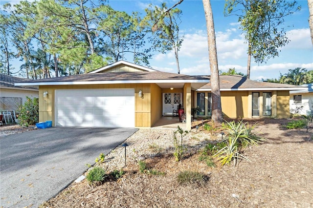 ranch-style home featuring a garage