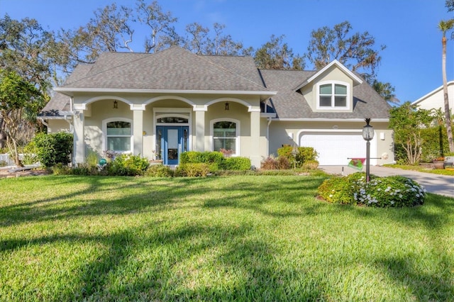 view of front of house featuring roof with shingles, stucco siding, concrete driveway, a garage, and a front lawn