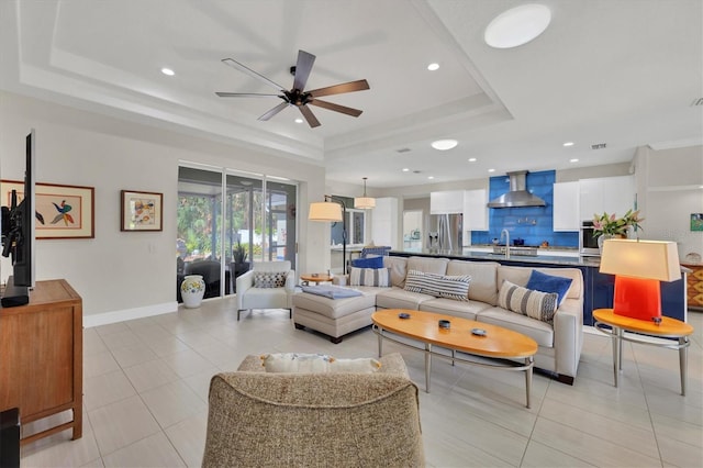 3301 River Woods Dr, Parrish, FL 34219 - living area featuring a tray ceiling, a ceiling fan, light tile patterned flooring, recessed lighting, and baseboards