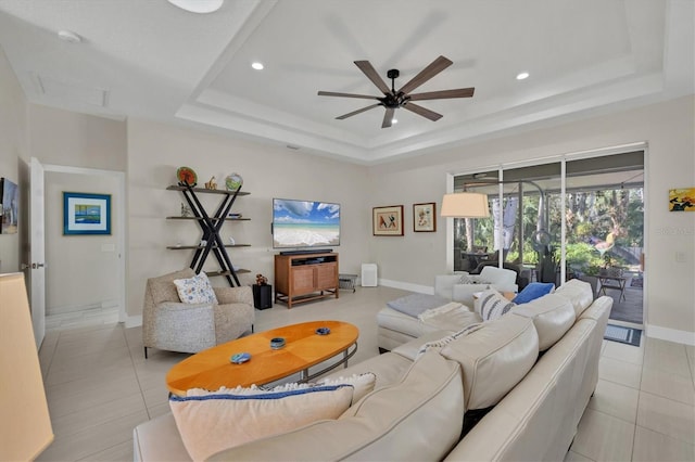 3301 River Woods Dr, Parrish, FL 34219 - living area featuring a raised ceiling, ceiling fan, light tile patterned floors, baseboards, and recessed lighting