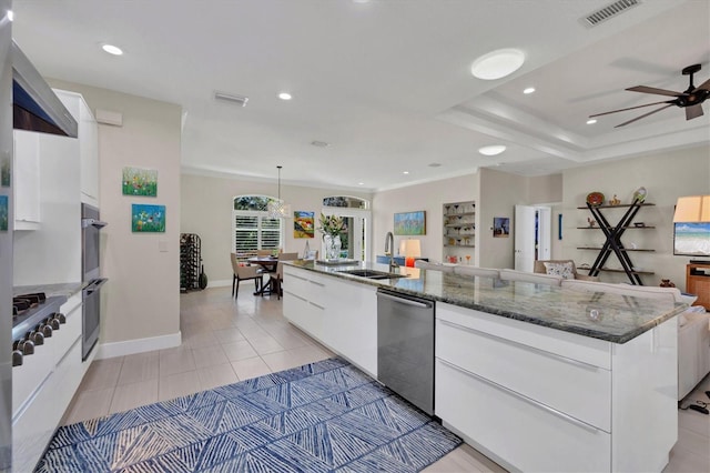 3301 River Woods Dr, Parrish, FL 34219 - kitchen featuring modern cabinets, a sink, white cabinetry, and recessed lighting