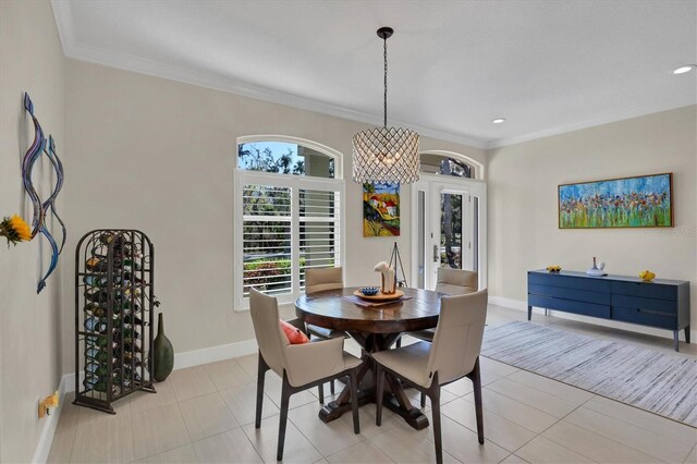 3301 River Woods Dr, Parrish, FL 34219 - dining area with ornamental molding, baseboards, light tile patterned flooring, recessed lighting, and french doors