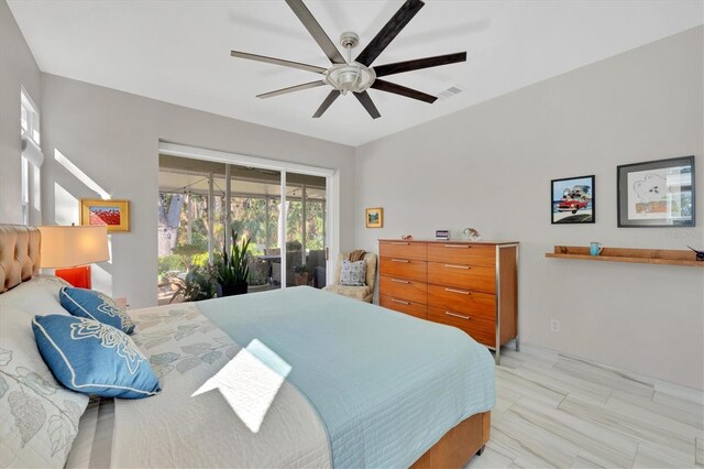 3301 River Woods Dr, Parrish, FL 34219 - bedroom with access to exterior and ceiling fan