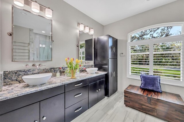 3301 River Woods Dr, Parrish, FL 34219 - bathroom featuring double vanity and marble finish flooring