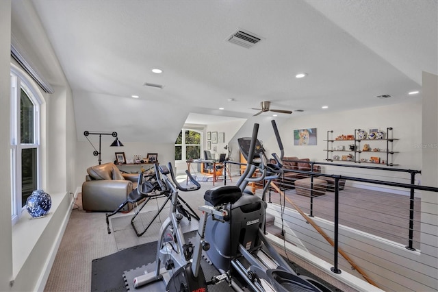 3301 River Woods Dr, Parrish, FL 34219 - workout area featuring vaulted ceiling, recessed lighting, ceiling fan, baseboards, and carpet floors