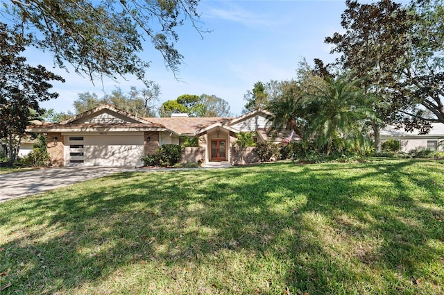 view of front of house with a garage and a front yard