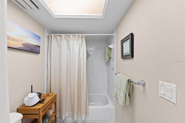 bathroom with shower / bath combination with curtain