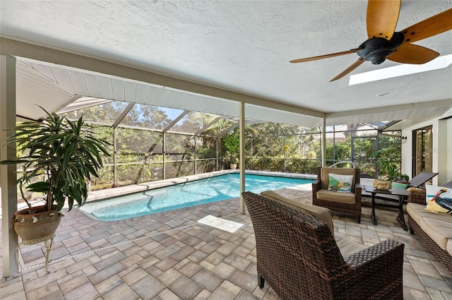 view of pool featuring an outdoor living space, a lanai, and a patio area