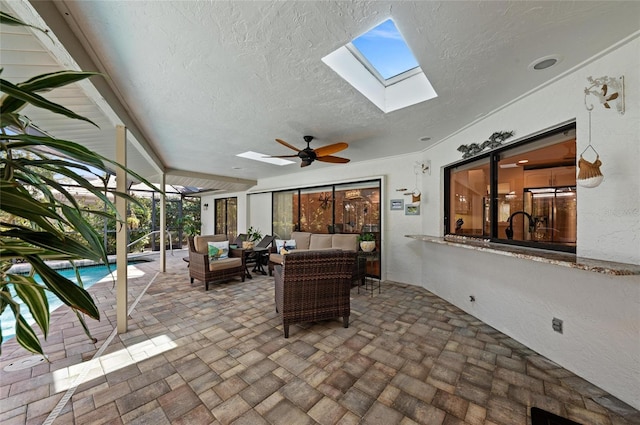 view of patio / terrace with ceiling fan and an outdoor living space