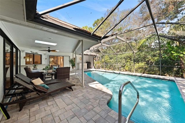 view of swimming pool featuring ceiling fan, outdoor lounge area, a patio, and a lanai