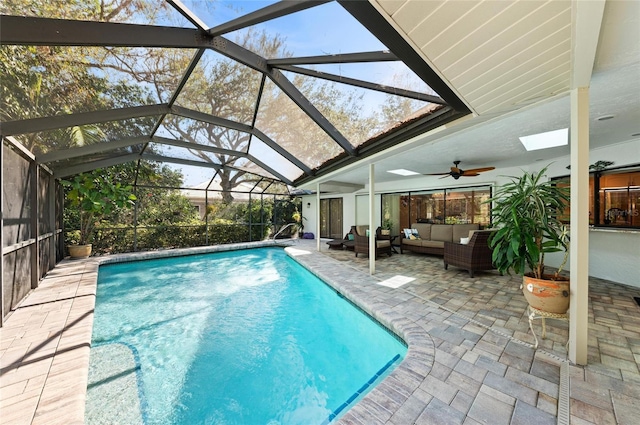 outdoor pool with glass enclosure, an outdoor living space, ceiling fan, and a patio
