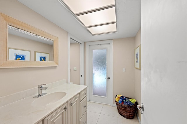 bathroom featuring tile patterned flooring and vanity