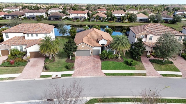 aerial view featuring a water view and a residential view