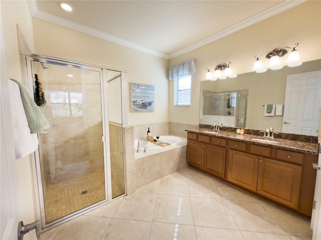 bathroom with a garden tub, crown molding, a sink, and a stall shower