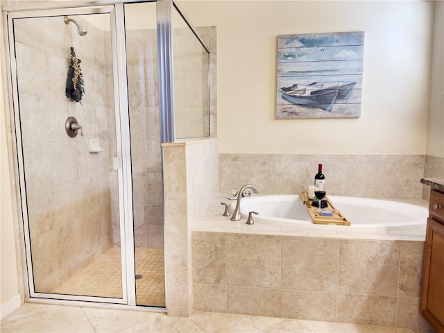 bathroom featuring a stall shower and a garden tub