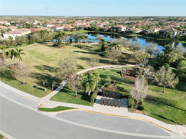 bird's eye view with a water view and a residential view