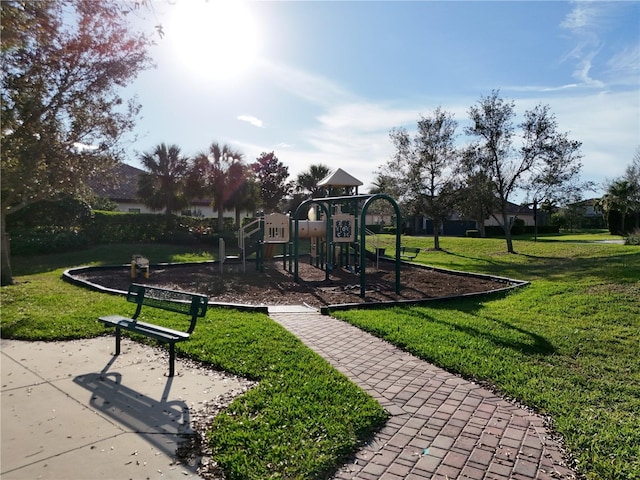 community jungle gym with a yard