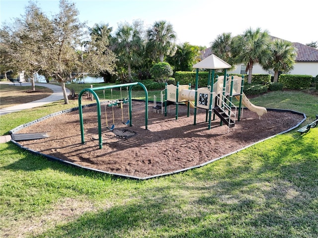 community jungle gym featuring a yard