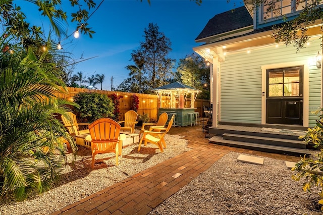 view of patio / terrace with a hot tub