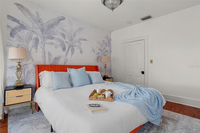 bedroom featuring hardwood / wood-style floors