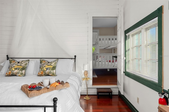 bedroom featuring dark hardwood / wood-style floors