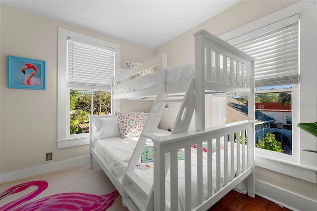 bedroom featuring multiple windows