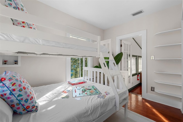 bedroom featuring wood-type flooring