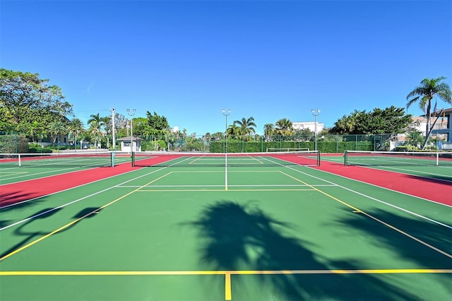 view of tennis court featuring basketball court