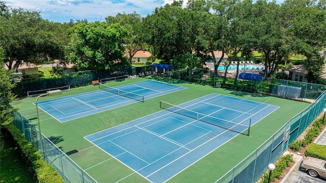 view of tennis court with fence