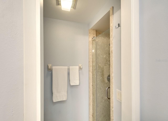 bathroom featuring a stall shower