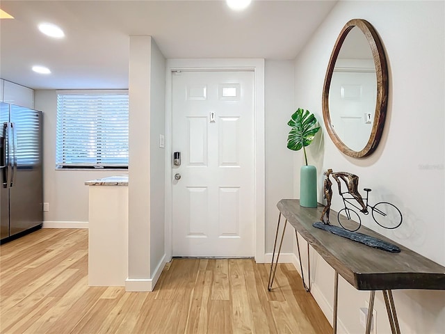 doorway with light hardwood / wood-style floors