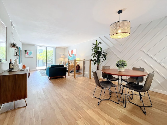 dining area with light hardwood / wood-style floors