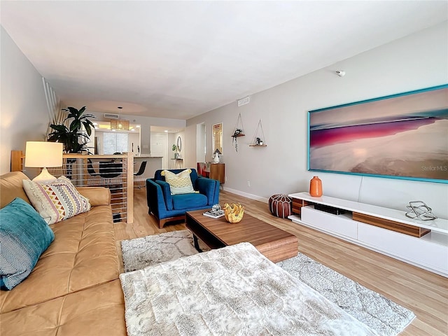 living room with light hardwood / wood-style floors