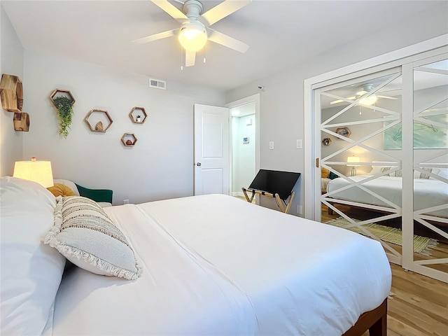 bedroom with hardwood / wood-style flooring and ceiling fan