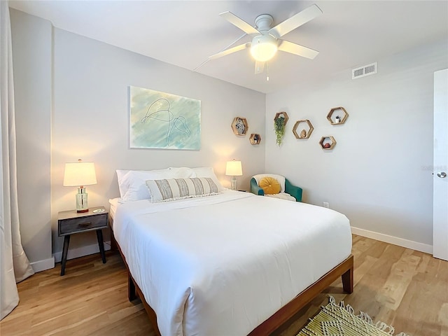 bedroom with hardwood / wood-style flooring and ceiling fan