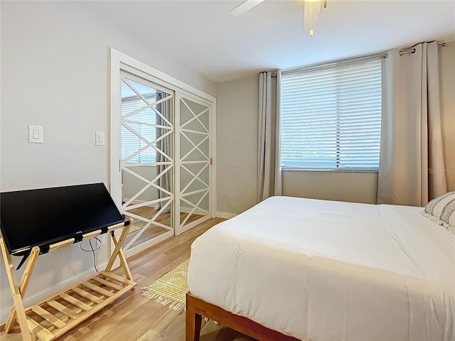 bedroom featuring hardwood / wood-style floors and ceiling fan