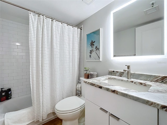 full bathroom with shower / tub combo, vanity, and toilet