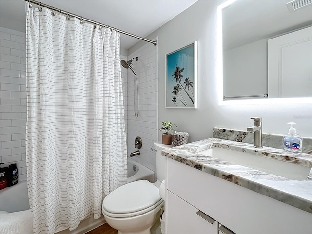 full bathroom featuring vanity, shower / tub combo, and toilet