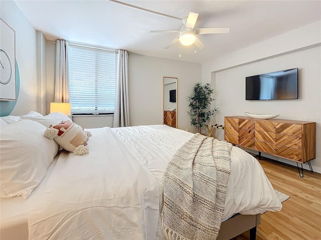 bedroom featuring ceiling fan and light hardwood / wood-style flooring