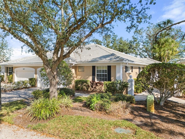 single story home featuring a garage