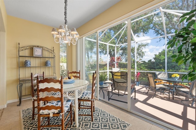 tiled dining room with a chandelier