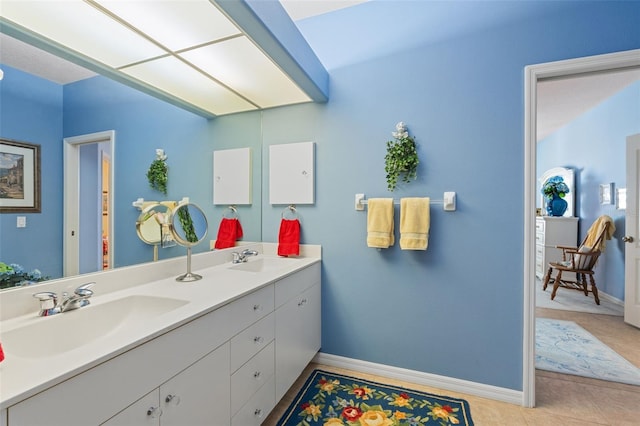 bathroom featuring tile patterned floors and vanity