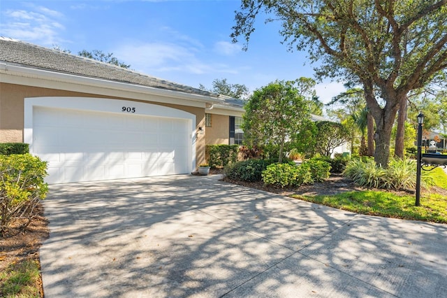 single story home featuring a garage